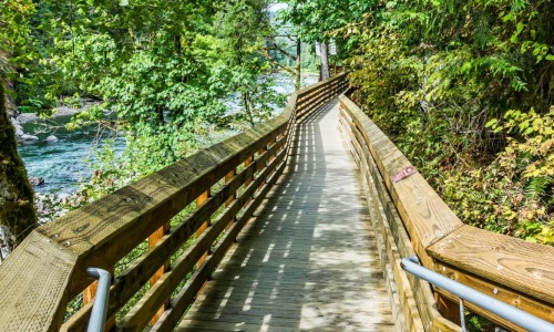 a wooden bridge over a river