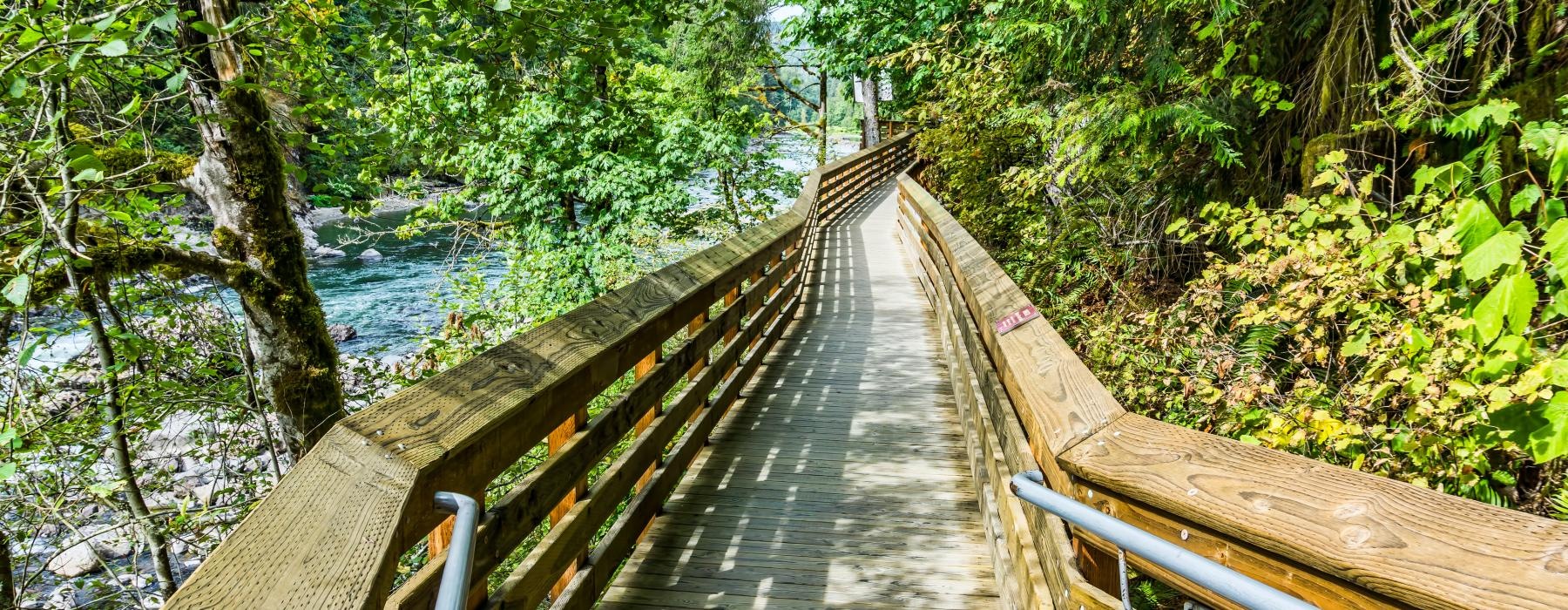 a wooden bridge over a river