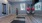 a room with a tv and bowling balls