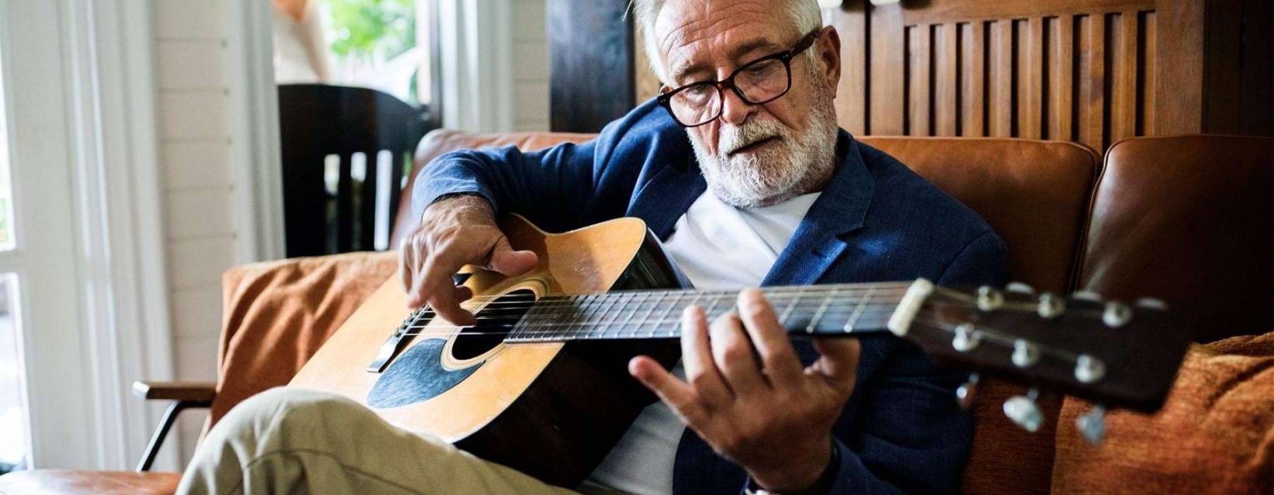 a man playing a guitar